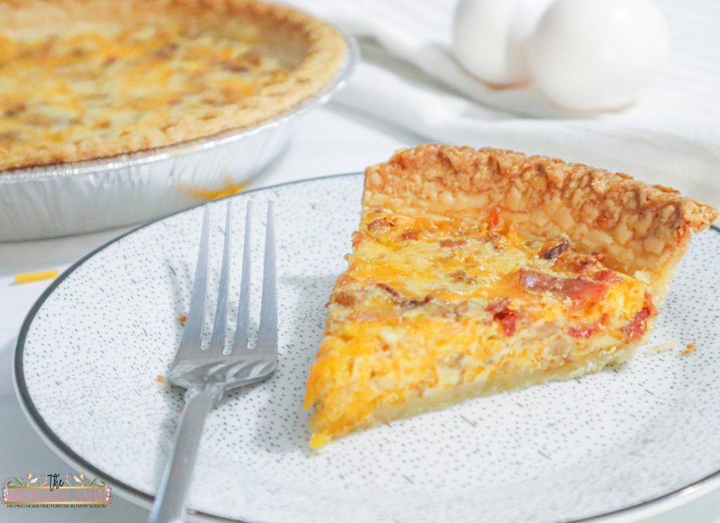 This delicious Breakfast Quiche with sausage and bacon is super easy to make and is sure to be a hit with the entire family.