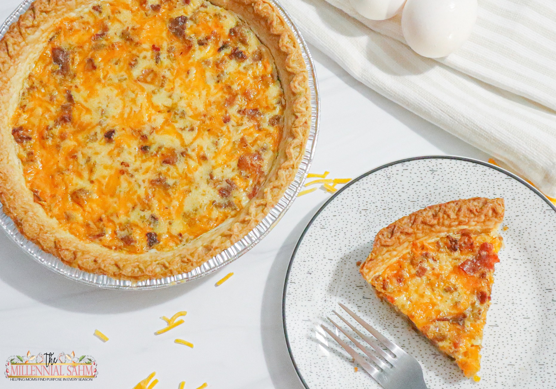 This delicious Breakfast Quiche with sausage and bacon is super easy to make and is sure to be a hit with the entire family.