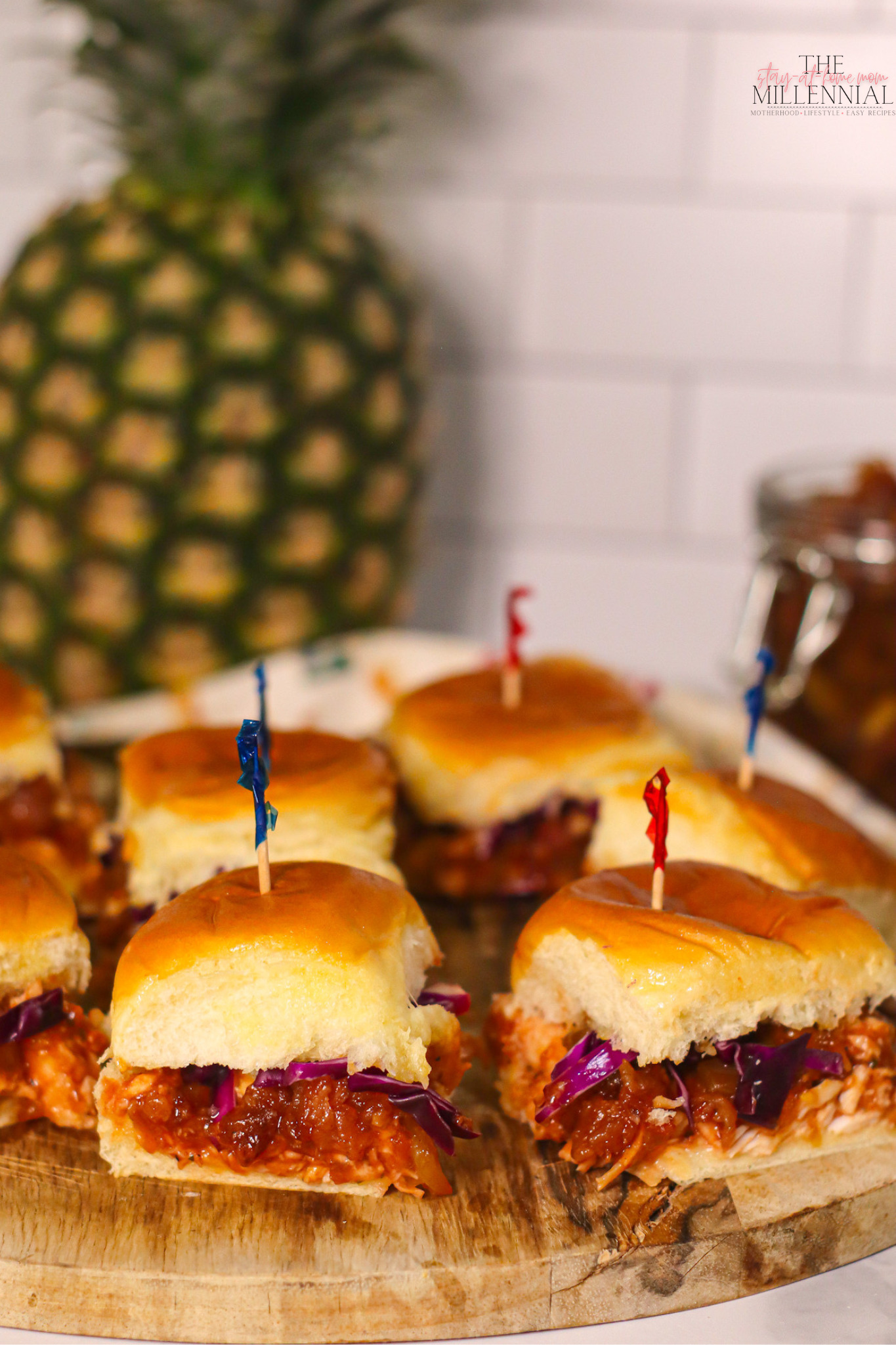 These BBQ Chicken sliders are topped with a delicious Pineapple Bacon Jam and are perfect for your next summer gathering!
