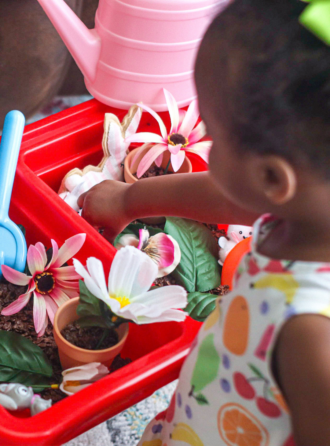 Sensory play has become a daily part of our morning routine and this garden-themed sensory table is perfect for your little learner!