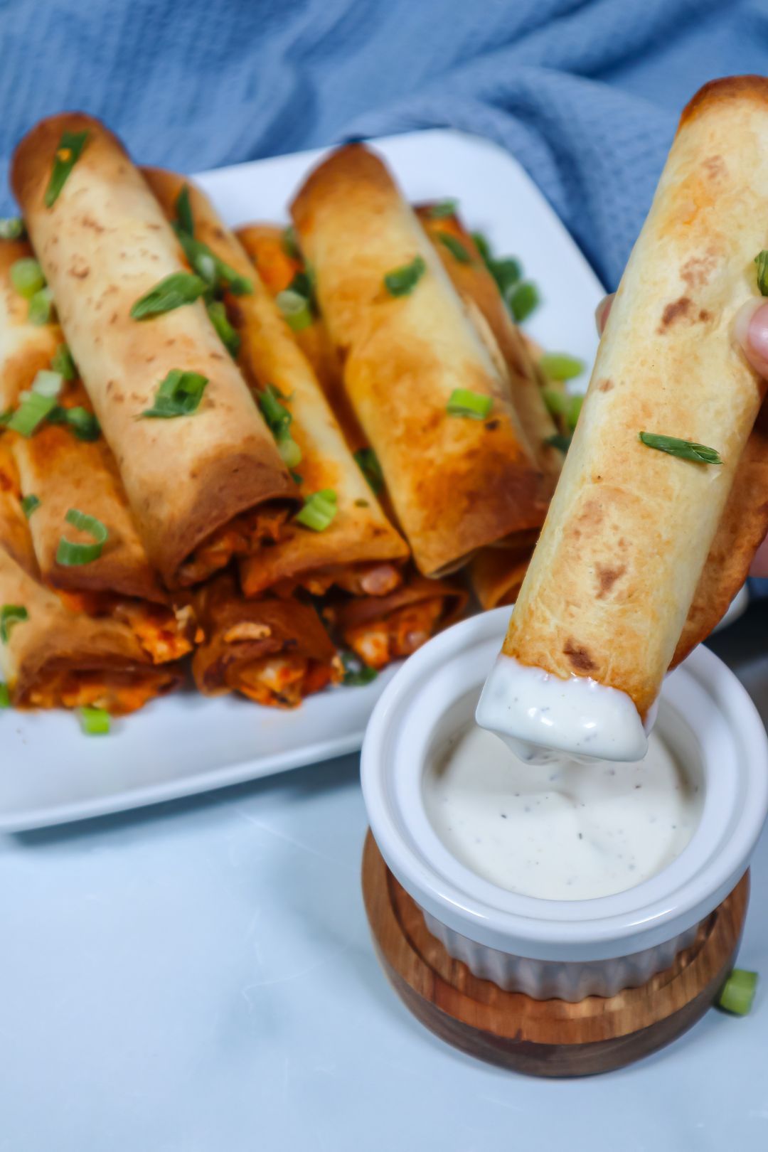 These air fryer buffalo chicken taquitos are full of flavor and can be whipped up in minutes - the perfect appetizer to have in your arsenal.